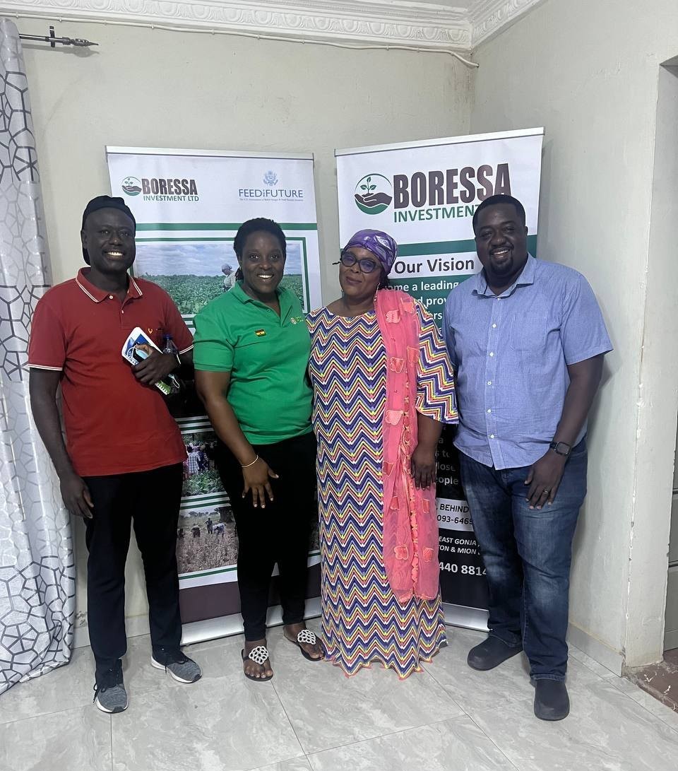 Diyana and colleagues reviewing an IFDC-supported business in northern Ghana